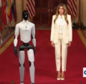 Watch Surreal Scene As Robot That Walks Like Joe Biden Disappears Behind Melania