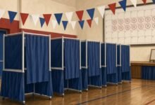 Illustration of empty voting booths in a gym polling place with patriotic bunting